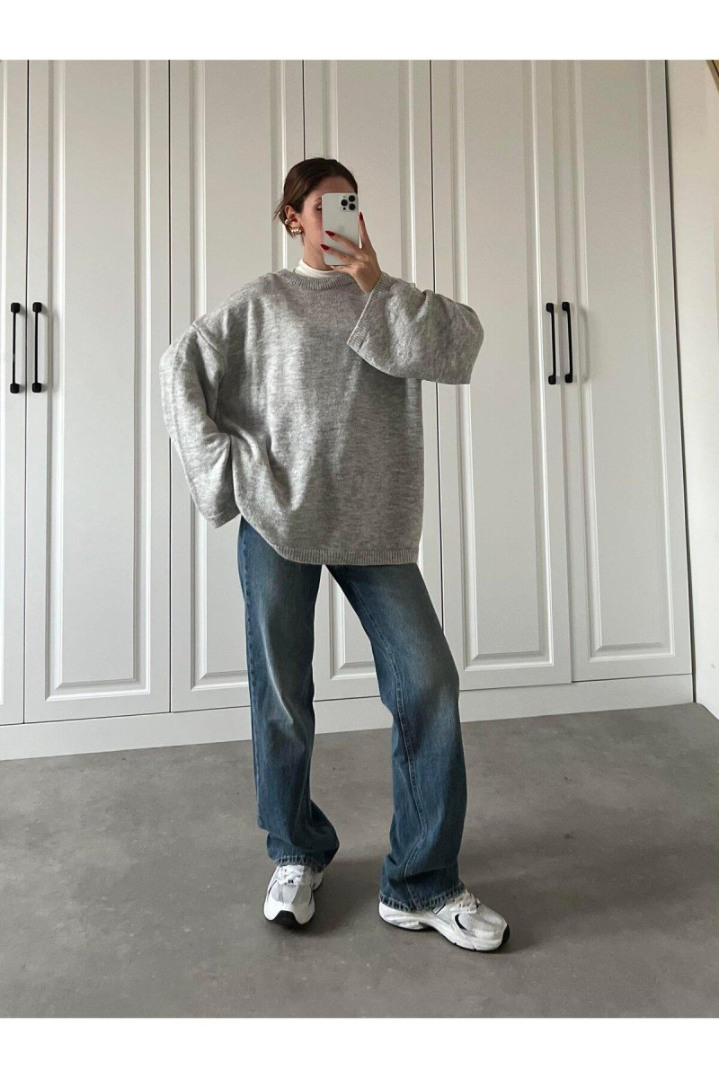 Oversized trui met casual broek