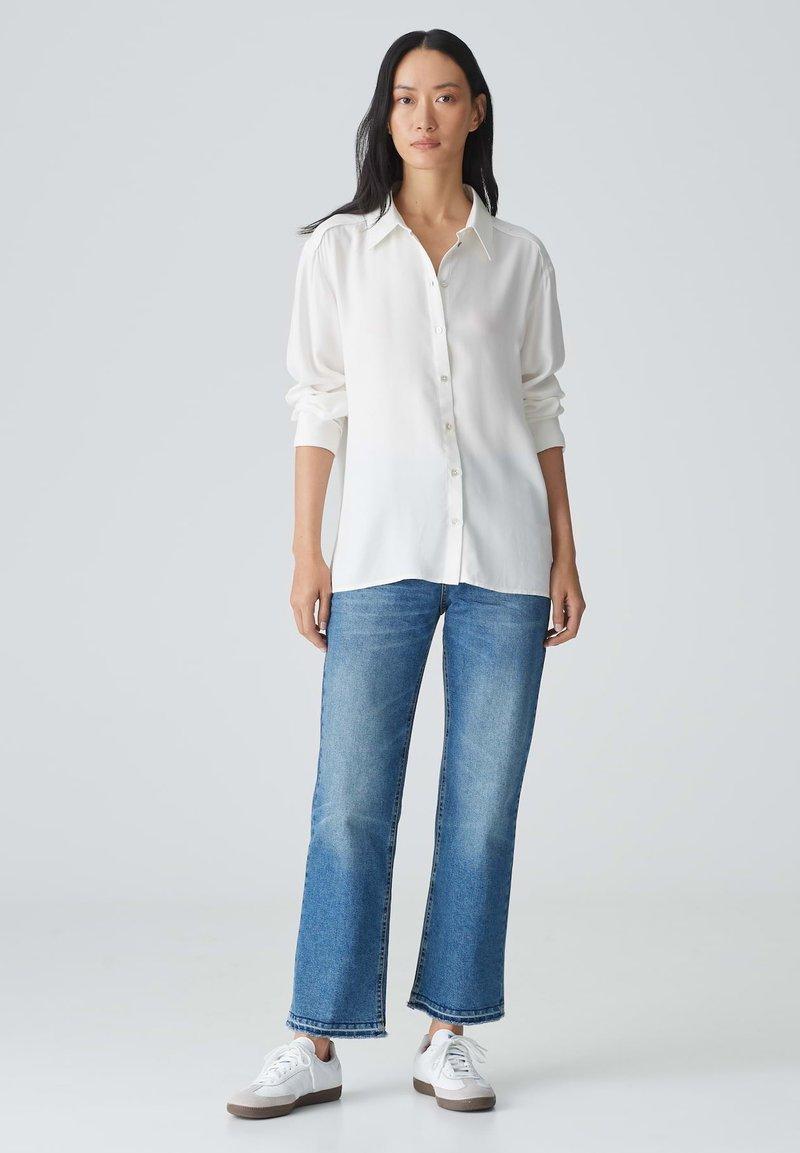 Witte blouse dames outfit