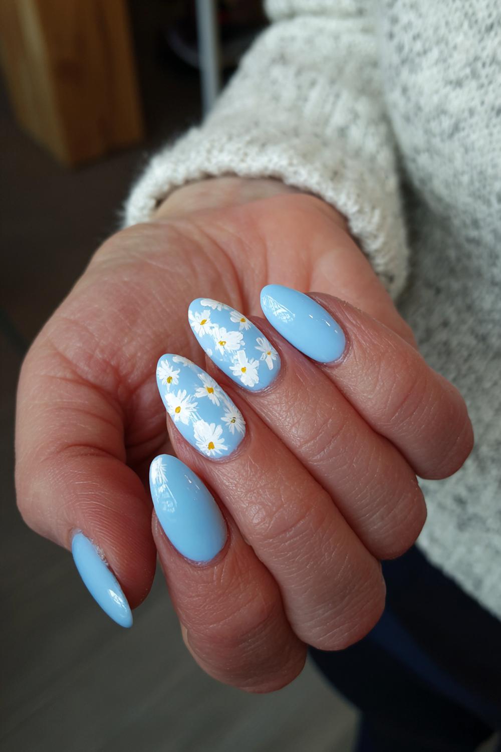25. Wiosenne paznokcie met wolkjes in wit op babyblauw